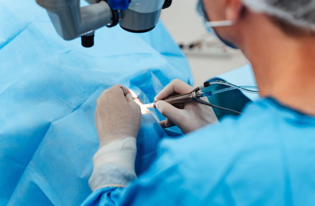 A close up of an ophthalmologist performing cataract surgery.